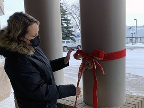 Sacred Heart Division staff members, like Nicole Bustin, bundled up to spread some holiday joy around Wetaskiwin last week.