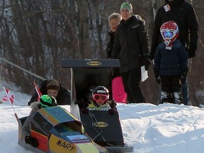 Push, pull or drag
It was a beautiful day for cardboard racing on the Gwynne Valley Ski Hill's tobaggon hill in February with racers of various designs taking up the challenge to cross the line first -- even if it involved pushing this creation over the finish line.
Christina Max