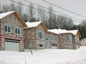 Homes are seen being built on Golf Club Road, Monday. Despite the pandemic, residential building permit values came in above average in 2020. Michael Lee/The Nugget