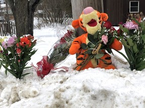 Flowers and a stuffed Tigger have been laid at the site where Jeff Twain was found on Jane Street, New Year's Day. Ghislain Nsengiyumva faces multiple charges, including second-degree murder, and remains in custody pending a bail hearing, Wednesday, by video. Supplied Photo