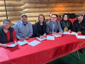 From left: Chief Marilyn Sinclair, of Washagamis Bay First Nation, Bill Wahpay, band councillor with Shoal Lake 40 First Nation, Minister Caroline Mulroney, Minister Greg Rickford, Chief Lorraine Cobiness, of Niisaachewan Anishinaabe First Nation, and Chief Chris Skead, of Wauzhushk Onigum First Nation, all signing the Memorandum of understanding on the twinning of Highway 17 on Feb. 5, 2020.