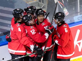 Bowen Byram (4), Jakob Pelletier (12), Jack Quinn (29), Quinton Byfield (19) and Jamie Drysdale (6) of Canada celebrate Byfield's goal against Switzerland during the 2021 IIHF World Junior Championship at Rogers Place on December 29, 2020 in Edmonton.