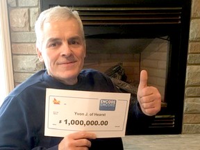 Hearst resident Yvon Jean is all smiles as he holds the $1 million cheque he received for winning the top ENCORE prize in the Dec. 27, 2019, LOTTO MAX draw. He has no immediate plans for the windfall, but hopes to purchase a boat at some point in the future. SUBMITTED PHOTO