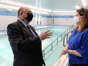 Sarnia-Lambton MPP Bob Bailey speaks Friday with Alison Morrison, executive director of the Pathways Health Centre for Children in Sarnia, at its newly refurbished aquatics centre. File photo/Postmedia Network