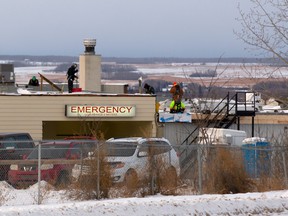 As roofers work on the Beaverlodge Hospital, it is hard to determine whether it is an emergency or more in the line of intensive care in this 2016 file photo. The community has been lobbying for a much-needed new hospital for more than 30 years.
RANDY VANDERVEEN