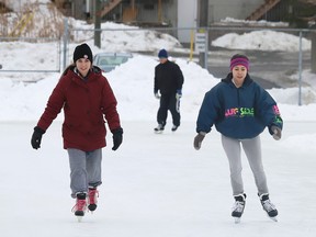 Athyna Ladouceur, left, and Tiffany Shewchuk skate at the Queen's Athletic Field skating oval in Sudbury, Ont. on Tuesday January 12, 2021.