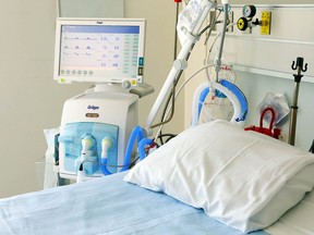A ventilator and bed stand ready for the arrival of a patient.