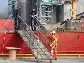 Crew members on the CCGS Giffon talk Thursday with a passing worker at Sarnia Harbour. CCGS Griffon is one of two Canadian Coast Guard icebreakers posted this season on the Great Lakes.