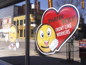 Signs supporting small business are seen around downtown North Bay, April 2020. Nugget File Photo