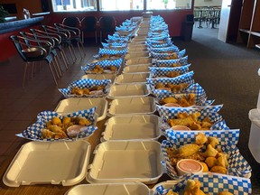 Partners Billiards and Bowling prepared more than 60 takeout orders of Chinese food, Friday, for residents on Bear Island. The orders were picked up by truck before making their way onto a snowmachine to be taken to customers. Supplied Photo
