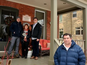 The Stratford-Perth branch of the Architectural Conservancy of Ontario presented its 300th historical plaque to the Bulbrook family at 191 Water Street in Stratford over Christmas. A gift for his parents from Hayden Bulbrook, the plaque commemorates Stratford Normal School English Master John McCutcheon, the first person to live in the home after it was built in 1908. Pictured from left are Darren, Sherry and Hayden Bulbrook, and Mark Yakabuski of the Architectural Conservancy of Ontario, Stratford-Perth branch. Galen Simmons/The Beacon Herald/Postmedia Network