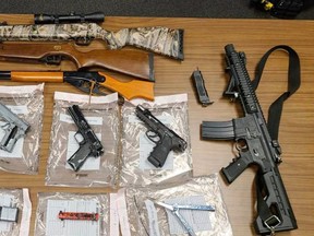 Additional charges have been laid against three people by the Woodstock police following a firearms warrant being issued Wednesday afternoon. Police said multiple unauthorized and replica weapons were seized. (Handout)