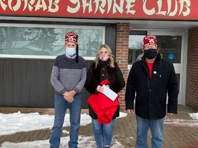 North Bay Rorab Shriner Alonzo Harris (left), North Bay resident Karen Matthews and North Bay Rorab Shriner President-in-waiting Dennis Harwood pose for a picture recently where Matthews handed over more than $900 that was raised from a GoFundMe page after a break-in at the club last November where more than $200 worth of Christmas cake was stolen.