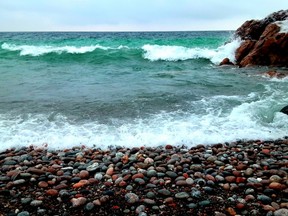 Waves curl onto an ice-free January Lake Superior shoreline at Montreal River Harbour. Embracing nature helps shoulder lockdown/COVID challenges. RUTH FLETCHER