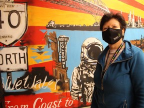 Owner Ellie Plata stands next to a mural inside Bluewater Joint, an authorized cannabis store that opened Monday on Murphy Road in Sarnia. It's the first licensed cannabis retail outlet in Sarnia.