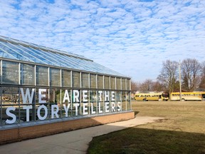 CK Public Health and Lambton Kent District School Board have partnered to work on a public art project at John McGregor Secondary School called We Are the Storytellers. The organizers of the project engaged students at the high school to learn about their thoughts on the COVID-19 pandemic. Their responses were then put on the windows of this greenhouse building in vinyl lettering. (Handout/Postmedia Network)