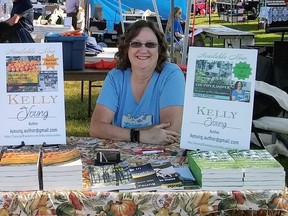 Chatham-based author Kelly Young, shown at a book signing in 2019, is releasing a new cozy mysery book called Lethal Shot on Flowerpot. (Handout/Postmedia Network)