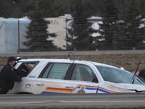 A Strathcona County RCMP officer was taken to hospital after a police cruiser rolled over while chasing suspects near Highway 21 on Tuesday, Jan. 19. Photo courtesy Arthur Green