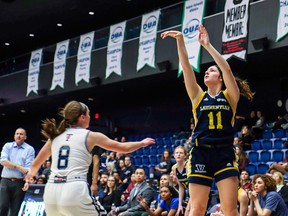 Laurentian Voyageurs guard Arielle Douillette (11) takes a shot during an OUA women's basketball game against the University of Toronto Varsity Blues in 2019-20.