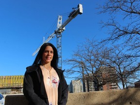 Mikelle Bryson-Campbell, acting executive director of the Sarnia-Lambton Workforce Development Board, stands next to a construction site in downtown Sarnia.