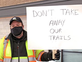 Steven Godfrey protests the closing of area snowmobile trails by the North Bay Parry Sound District Health Unit, Monday.
PJ Wilson/The Nugget
