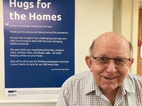 Huronview Homes for the Aged resident Harry Pennings stands in front of a recently installed poster thanking healthcare workers for their effort over the last 10 months. Handout