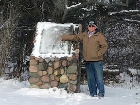 Jim Crane is shown next to a memorial rock at the former Crane Conservation Area, which was founded by his great uncle, Dr. James W. Crane. The Lower Thames Valley Conservation Authority sold the property to a private buyer in February 2019. (Handout/Postmedia Network)