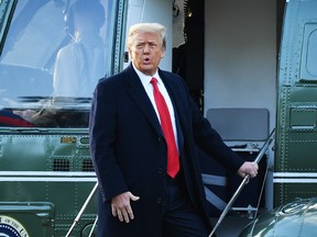 In this file photograph taken on Jan. 20, 2021, outgoing US President Donald Trump boards Marine One at the White House in Washington, DC.MANDEL NGAN/AFP via Getty Images