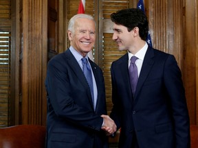 FILE PHOTO: Canada's Prime Minister Justin Trudeau (R) shakes hands with U.S. Vice President Joe Biden during a meeting in Trudeau's office on Parliament Hill in Ottawa, Ontario, Canada, December 9, 2016. REUTERS/Chris Wattie/File Photo