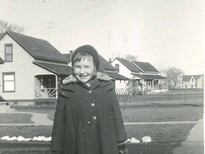The Girl in the Engine. Joyce Vye, at seven years old, standing in front of her house at the corner of Wallace and Huron streets. Ready to walk one mile to the former DA Gordon School at the corner of King and Murray streets. To this day, Joyce remembers the "red coat with the gray fur collar" that she wore to school. Photo submitted by Joyce Ritchie.