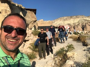 Mert Tanner leads a tour group through Turkey. SUBMITTED