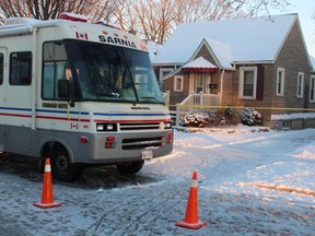 The Sarnia police mobile command post is parked Wednesday morning outside a home in 500 block of Devine Street. City police are investigating the city's fourth homicide in 2021.