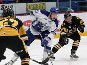 Nolan Hutcheson, middle, of the Sudbury Wolves, breaks to the net during OHL action against the Hamilton Bulldogs at the Sudbury Community Arena in Sudbury, Ont. on Friday October 19, 2018.