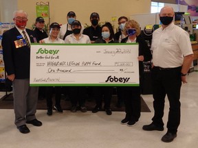 The Legions’ Walter Myslicki and (from left to right) Bob Collins, Sobeys staff and Owner of Sobeys High River, Jason McCauley during a $1,000 cheque presentation to the Legion’s Poppy Campaign on Jan. 22 at Sobeys.