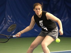 Chloe Madore-Bouffard, of Ecole secondaire Macdonald-Cartier, returns a volley during the girls high school singles final at the Sudbury Indoor Tennis Centre in Sudbury, Ont. on Thursday May 11, 2017.