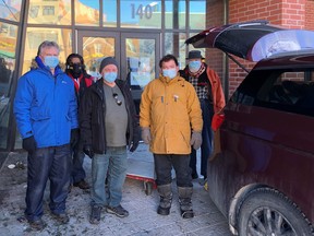 In the front are Tom Morris (master of Nickel Masonic Lodge); Paavo Liukko and Greg Blomme; in the rear are Larry Paguanda and Lionel Rudd. The Nickel Masonic Lodge has donated winter clothing to the Sudbury YMCA. Supplied.