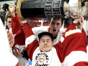 When the Pembroke Lumber Kings won the CCHL championship in 2007, Jason Stewart was on the ice to celebrate with the team. Here team captain Scott Campbell helps him hoist the Art Bogart Cup.