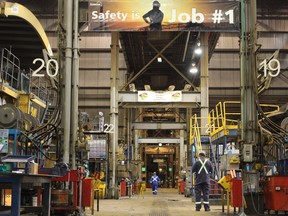 Safety reminders hang over a heavy hauler maintenance shop at Suncor Energy's base plant, located north of Fort McMurray, Alta., on Wednesday September 27, 2017. Vincent McDermott/Fort McMurray Today/Postmedia Network