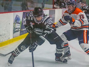 Photo courtesy NOJHL    

Soo Thunderbirds defenceman Connor Toms (right) battles for the puck with an unidentified Espanola Express player during 2020 NOJHL action in Espanola