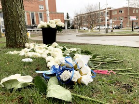 REMEMBERING AUDREY Rain falls on flowers lying outside Brockville General Hospital on Good Friday morning. The flowers were placed there as a tribute to Audrey Hopkinson, a BGH nurse who was murdered Apr. 1. (FILE PHOTO)