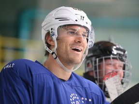 Marcus Foligno smiles as he watches the game  at the NHL vs Docs hockey game in support of the NEO Kids  Foundation in Sudbury, Ont. on Thursday August 10, 2017.