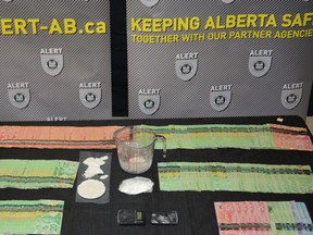 Cash and crack cocaine seized by Wood Buffalo RCMP and ALERT from a home in downtown Fort McMurray on Jan. 22, 2021. Supplied Image/ALERT