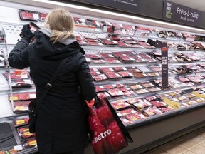 Customer shopping at a meat counter