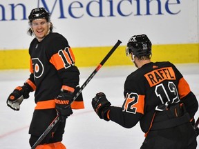 Philadelphia Flyers' Travis Konecny (11) skates off the ice with Michael Raffl (12) after defeating the Pittsburgh Penguins at Wells Fargo Center in Philadelphia on Jan. 15, 2021. (Eric Hartline-USA TODAY Sports)