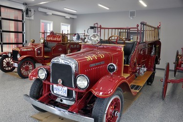 A 1921 antique fire truck (left), and a 1929 model built in Mitchell, are part of the 1,000 sq. ft. museum area in the West Perth fire station. ANDY BADER