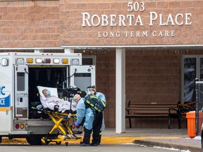 Paramedics transport a person from Roberta Place, a long-term seniors care facility which is the site of a coronavirus disease (COVID-19) outbreak, in Barrie, Jan. 18.  REUTERS/Carlos Osorio