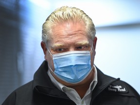 Ontario Premier Doug Ford leaves after addressing the media where they store the Moderna COVID-19 vaccine at the Trillium Health Partners Hospital during the COVID-19 pandemic in Mississauga, Ont., on Dec. 30. 
NATHAN DENETTE /THE CANADIAN PRESS
