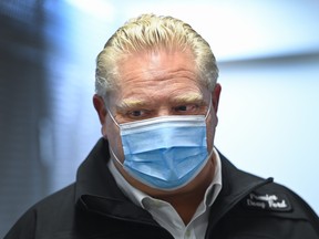 Ontario Premier Doug Ford leaves after addressing the media where they store the Moderna COVID-19 vaccine at the Trillium Health Partners Hospital during the COVID-19 pandemic in Mississauga, Ont., on Wednesday, December 30, 2020.
