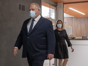 Ontario Premier Doug Ford and Health Minister Christine Elliot walk out after being given a tour of a digital Intensive Care Unit room at Cortellucci Vaughan Hospital in Vaughan, Ontario on Monday, January 18, 2021. PHOTO BY FRANK GUNN /THE CANADIAN PRESS
