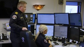 Regional Fire Chief Jody Butz and a dispatcher with Regional Emergency Services. Supplied Image/RMWB